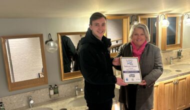 Becky Wall with Keiran Baggott, supervisor at the adventure play ground, at Great Windsor Park being awarded highly commended in the individual washroom cleaner for England. <i>(Image: supplied)</i>