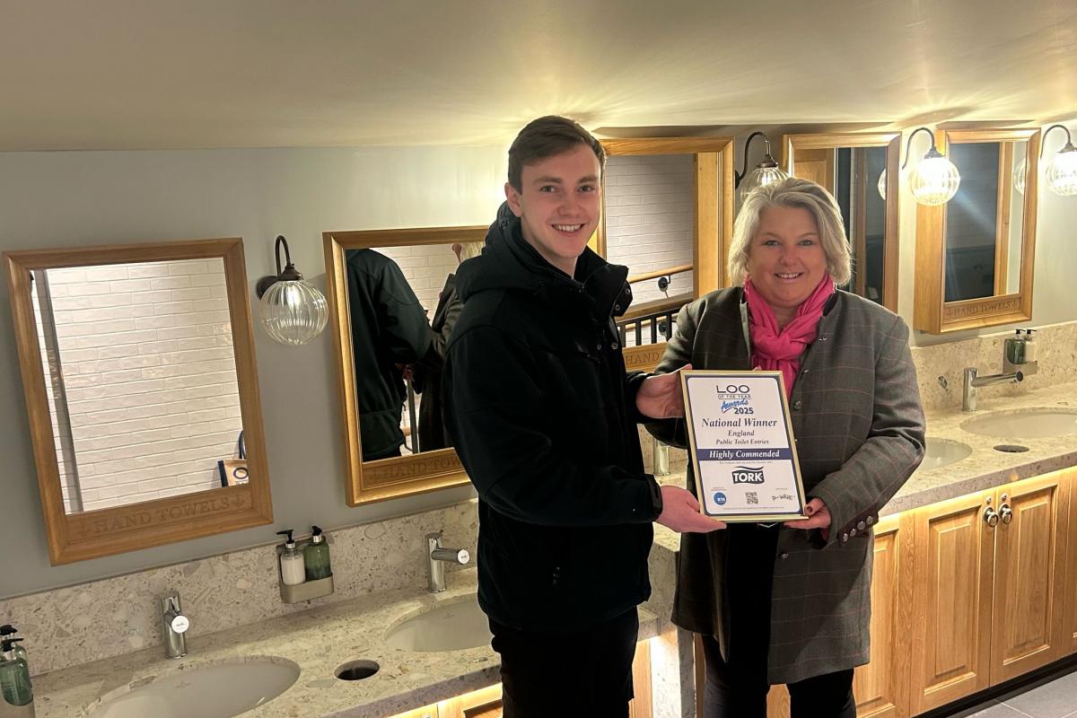 Becky Wall with Keiran Baggott, supervisor at the adventure play ground, at Great Windsor Park being awarded highly commended in the individual washroom cleaner for England. <i>(Image: supplied)</i>