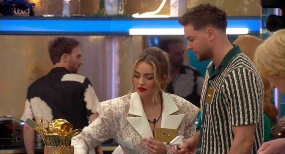 EROTEME.CO.UK FOR UK SALES: Contact Caroline If bylined must credit ITV2 Celebrity Big Brother - Day One Picture shows: Chris Hughes and Ella Rae Wise wiping the surfaces down. NON-EXCLUSIVE Date: Tuesday 8th April 2025 Job: 250408UT12 London, UK EROTEME.CO.UK Disclaimer note of Eroteme Ltd: Eroteme Ltd does not claim copyright for this image. This image is merely a supply image and payment will be on supply/usage fee only.