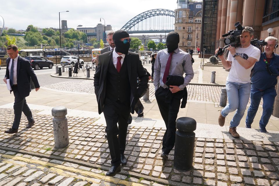 Daniel Graham (centre left) and Adam Carruthers (centre right) leaving Newcastle upon Tyne Magistrates’ Court after an appearance in May 2024 (Owen Humphreys/PA)