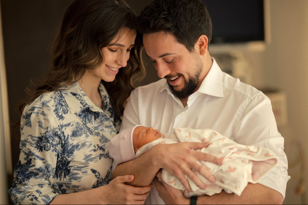Hussein and Rajwa with baby Iman