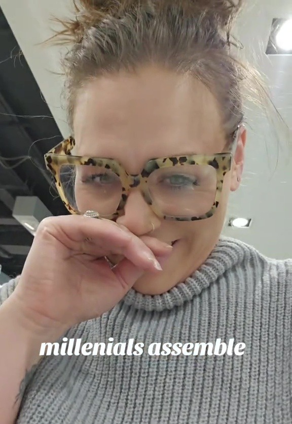 Woman in glasses giggling, text overlay: "millennials assemble"