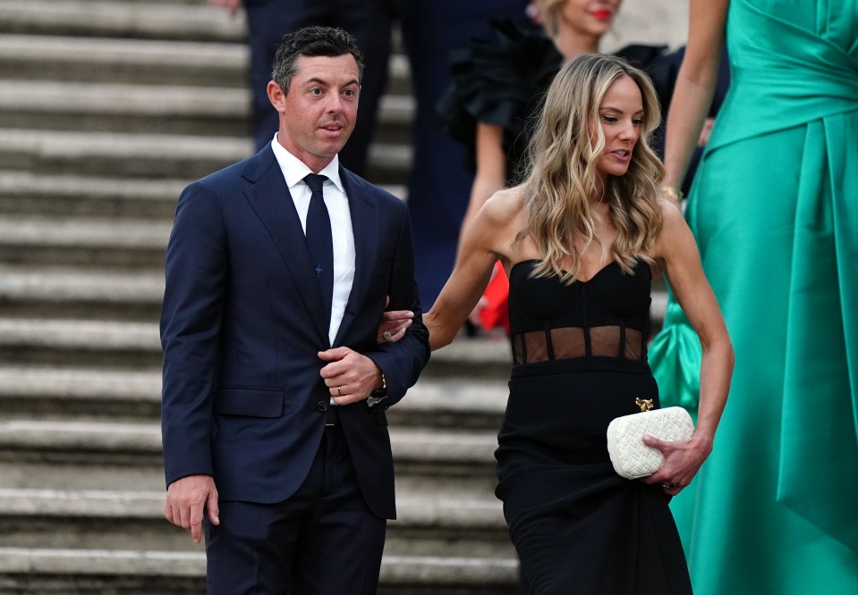 Rory McIlroy and his wife Erica walking together.