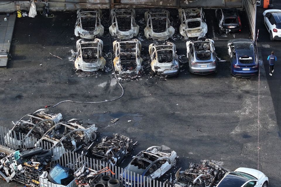 Burned-out Tesla cars at a dealership.