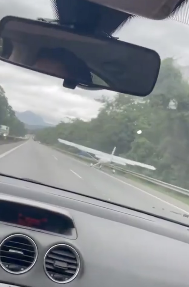 Heart-stopping moment plane dodges cars & lorries as pilot forced to make emergency landing on motorway
