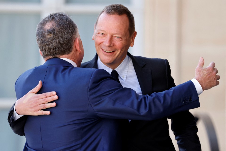 Emmanuel Bonne embracing Steve Witkoff.