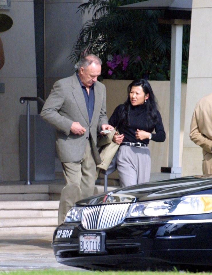 Gene Hackman and Betsy Arakawa are seen together.