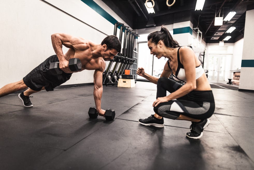 couple of fitness models doing the pushups