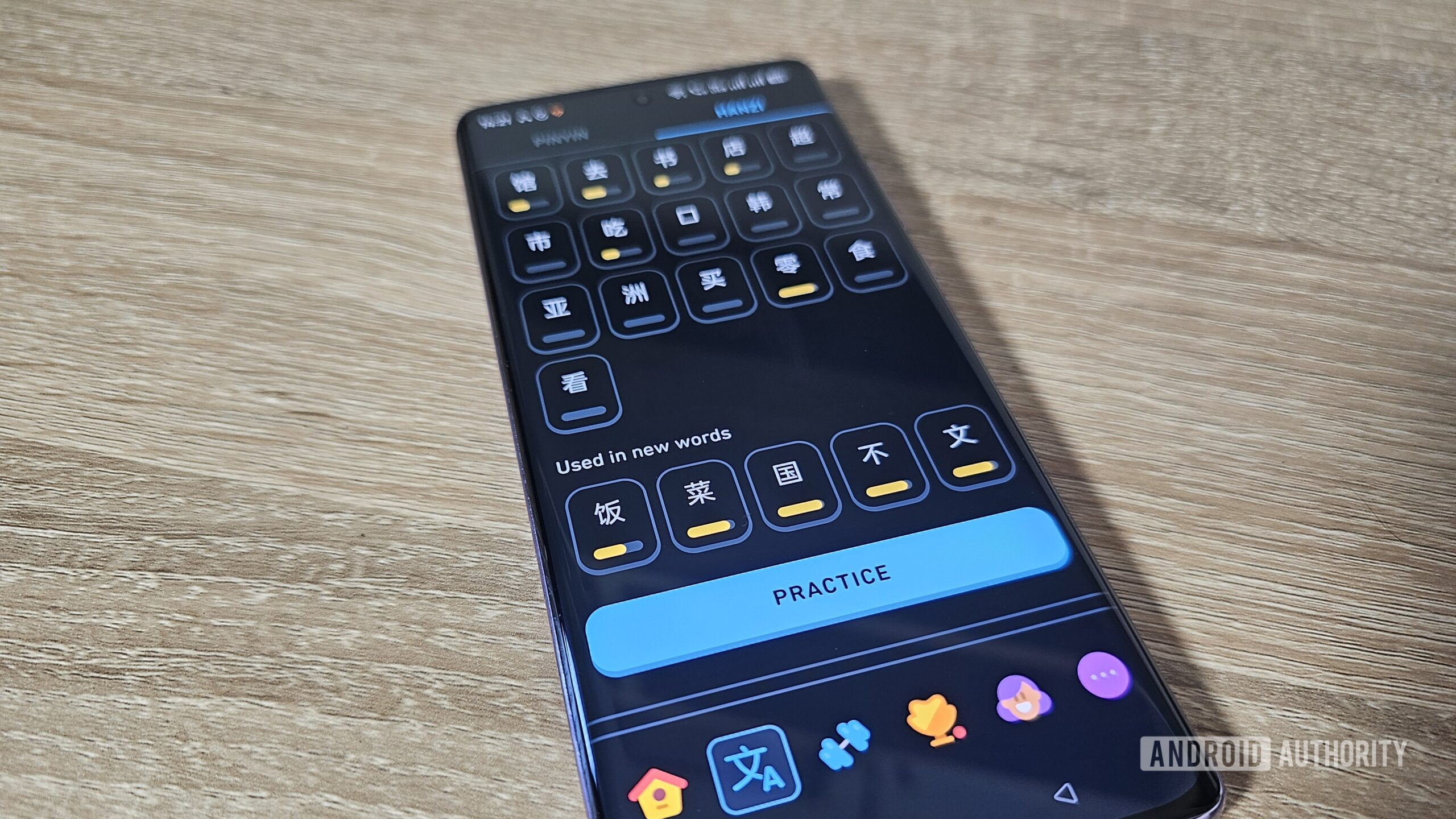 hanzi lessons in the duolingo app shown on a smartphone