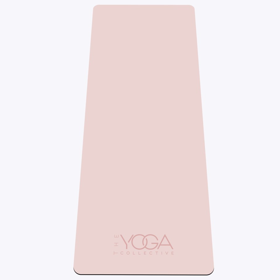 Pink yoga mat with The Yoga Collective logo.