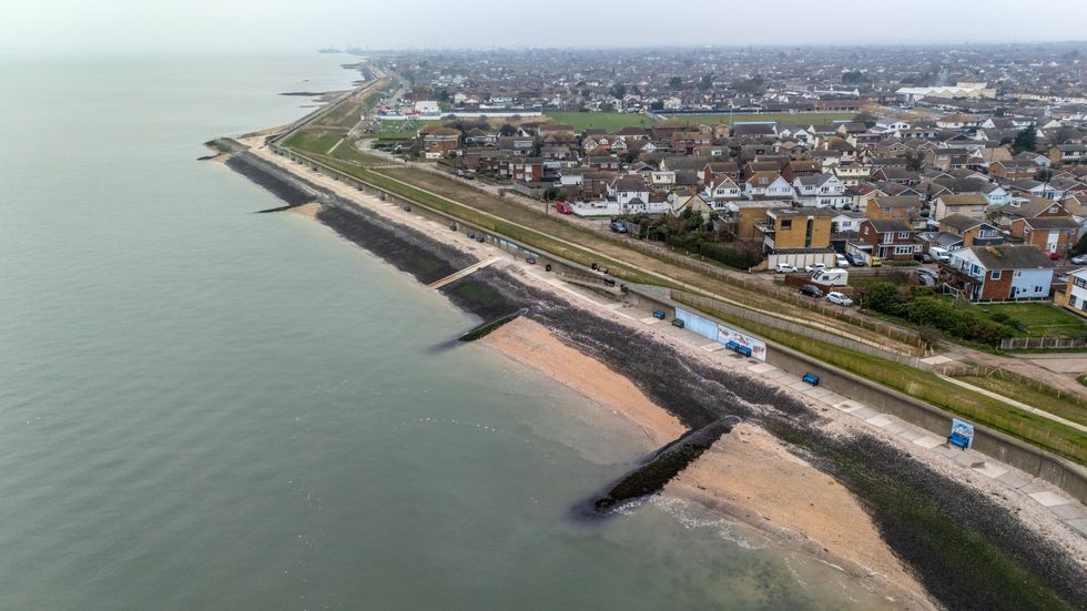 Houses lie next to the shoreline on March 24, 2025 in Canvey Island