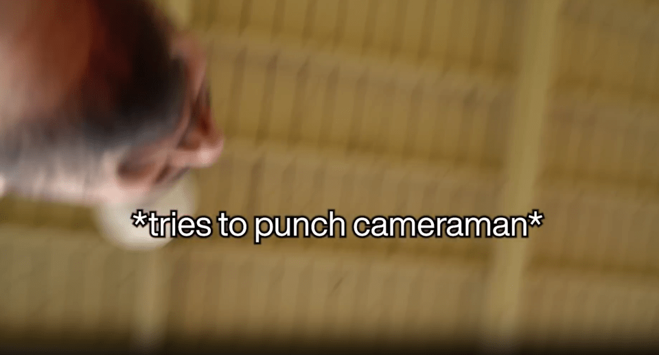 Person tries to punch cameraman.