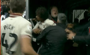 Soccer players and staff involved in a scuffle.