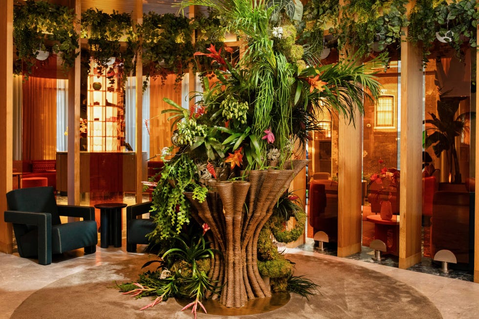 lush indoor plant installation serving as an architectural focal point in a lounge area