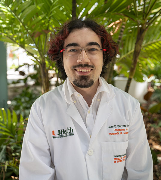 Jose Domingo “Pepe” Barrera-Paez, in a white clinic coat