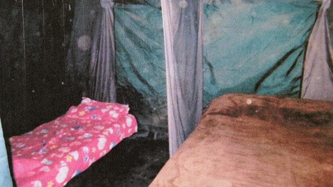 Interior of a tent with two beds.