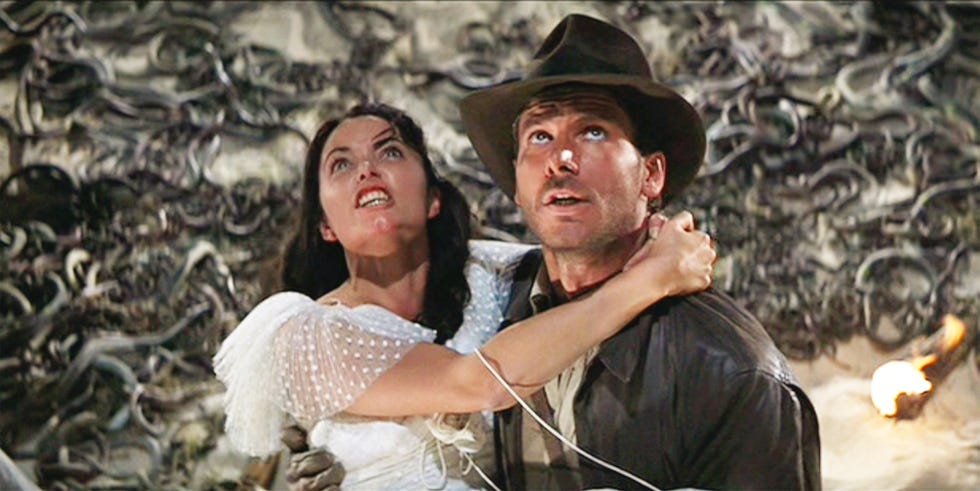 los angeles   june 12 the movie indiana jones and the raiders of the lost ark , aka raiders of the lost ark, directed by steven spielberg  seen here from left, karen allen as marion ravenwood held by harrison ford as indiana jones in the snake infested well of the souls chamber  initial theatrical release june 12, 1981  screen capture a paramount picture photo by cbs via getty images