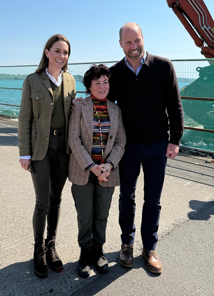 Kate Middleton, Prince William, and Ruby Wax posing for a photo.