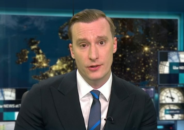 ITV newsreader Paul Brand presenting the news.