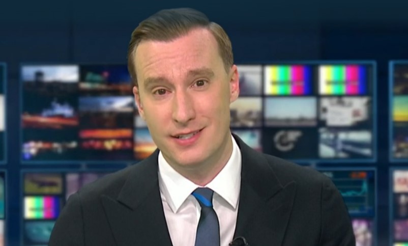 ITV newsreader Paul Brand presenting the news.
