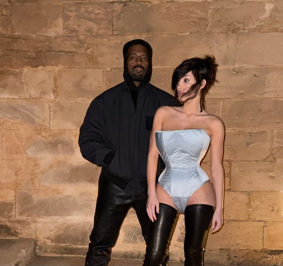Kanye West and Bianca Censori posing together.