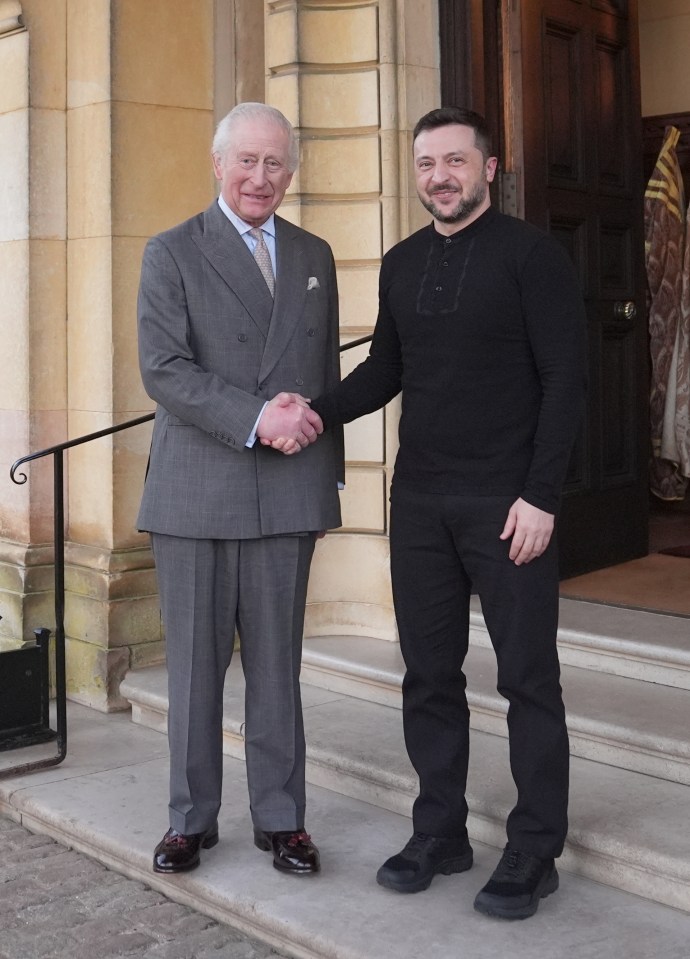 King Charles III shaking hands with Ukrainian President Volodymyr Zelensky.