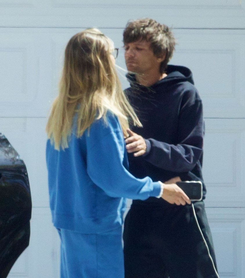 Louis Tomlinson and Zara McDermott sharing a moment.