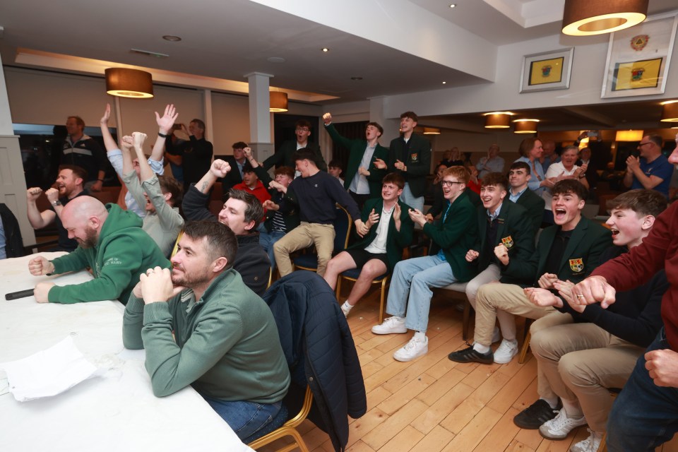 Members of Rory McIlroy's Holywood Golf Club watching him play.