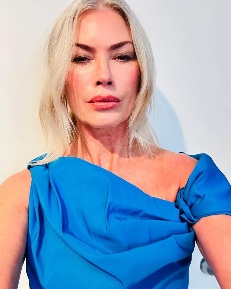 Carré Otis in a blue dress.