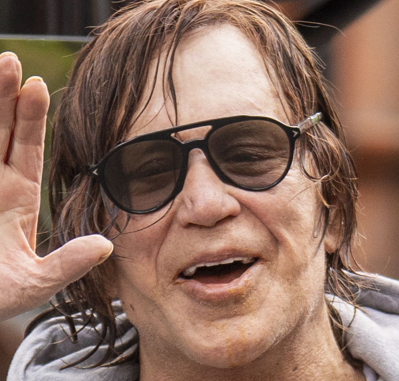 Mickey Rourke waving goodbye.