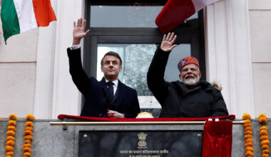 French President Emmanuel Macron and Indian Prime Minister Narendra Modi wave from the balcony during the inauguration of the Indian Consulate as part of a visit in Marseille, France, on February 12, 2025. (Photo by Christian Hartmann / POOL / AFP) (Photo by CHRISTIAN HARTMANN/POOL/AFP via Getty Images)