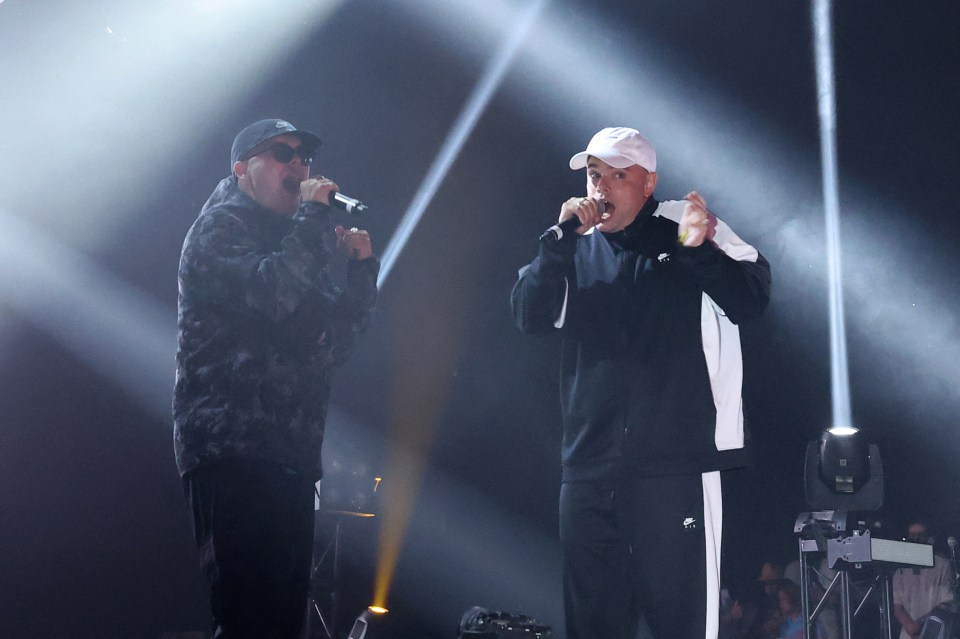 Kneecap, an Irish hip hop trio, performing on stage.