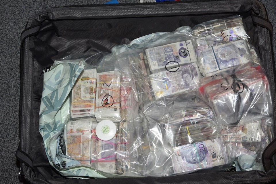 Suitcase full of cash seized during a money laundering investigation.