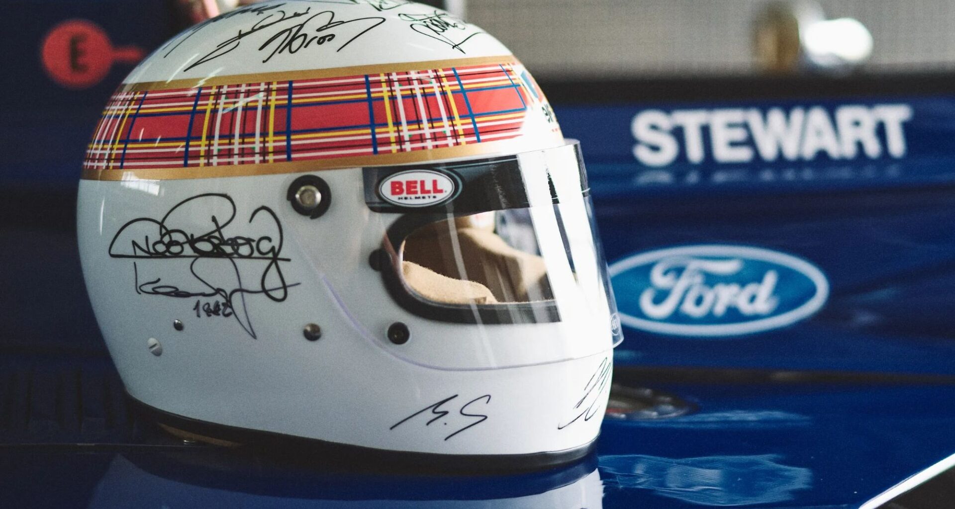 Michael Schumacher signs charity helmet with help from wife Corinna in one of his only public acts since ski crash