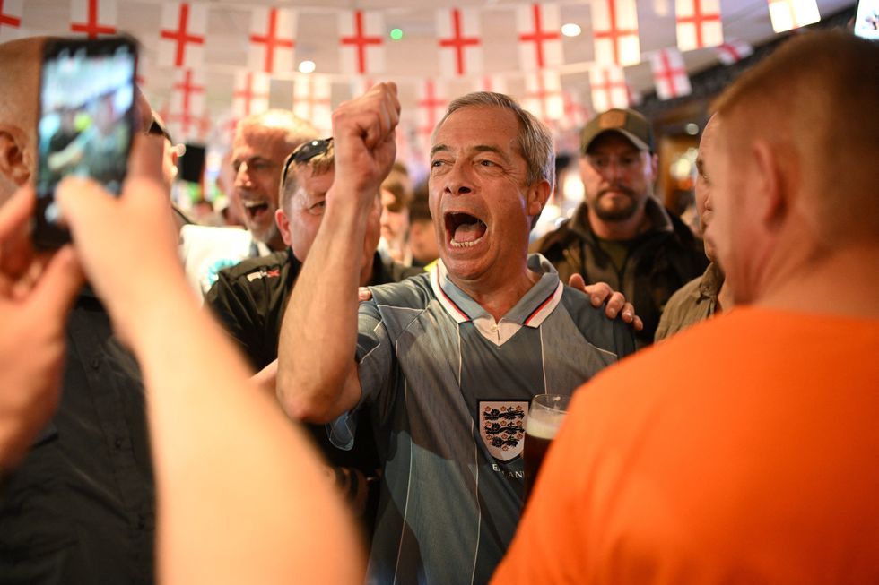 Nigel Farage celebrating England's goal at the pub in the 2024 Euros