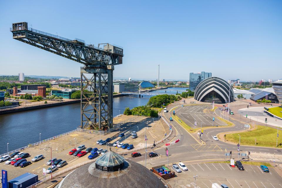 Aerial view of the River Clyde in Glasgow, showing the Finnieston Crane, SECC Armadillo, and Govan district.