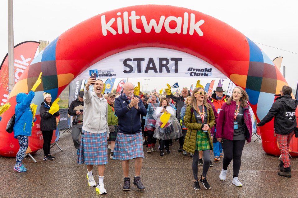 Paddy McGuinness and Sir Tom Hunter at the start of a Kiltwalk.