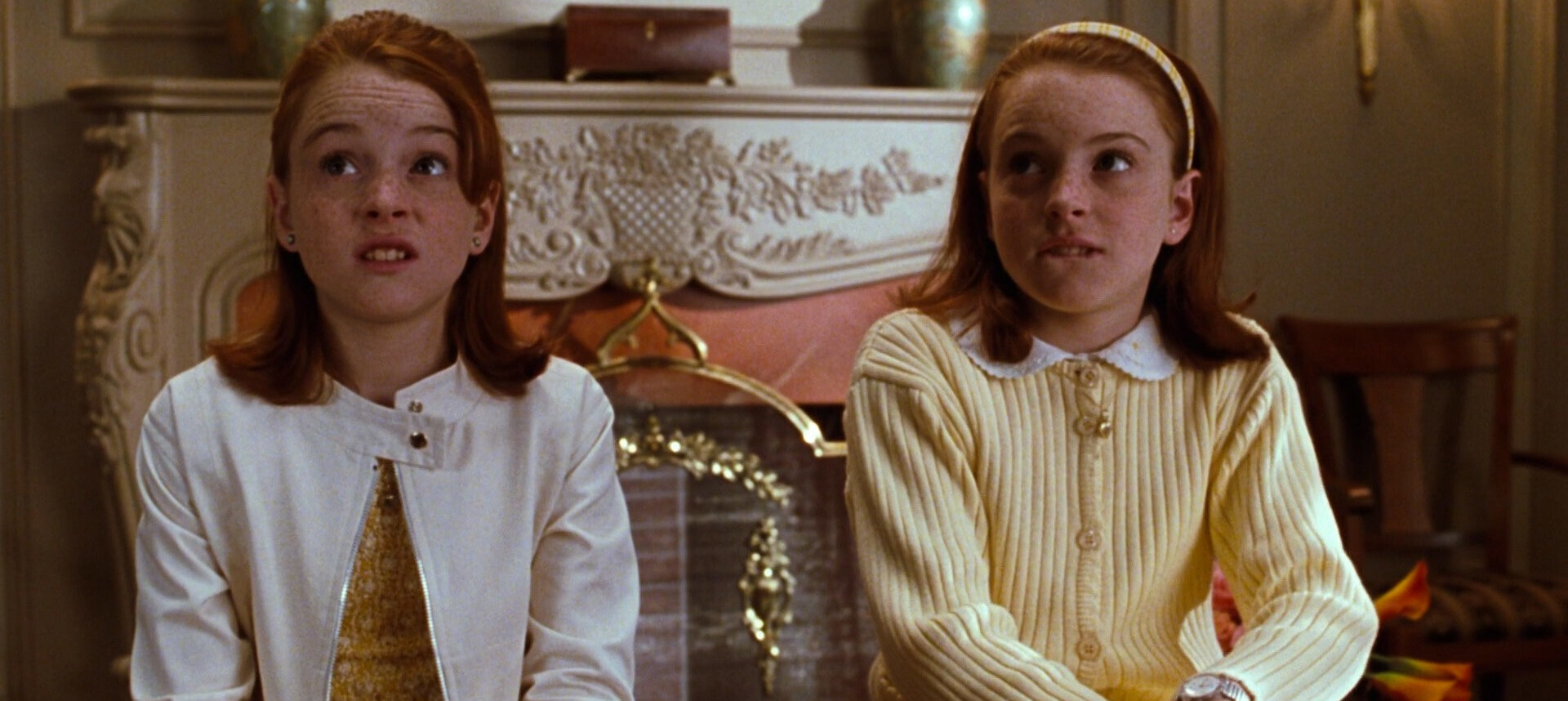 Screenshot of two Lindsay Lohans looking shocked in The Parent Trap