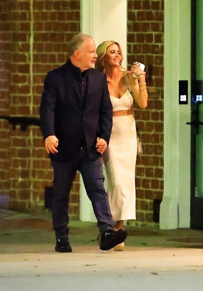 Paul Kemsley and Shana Wall walking hand-in-hand.