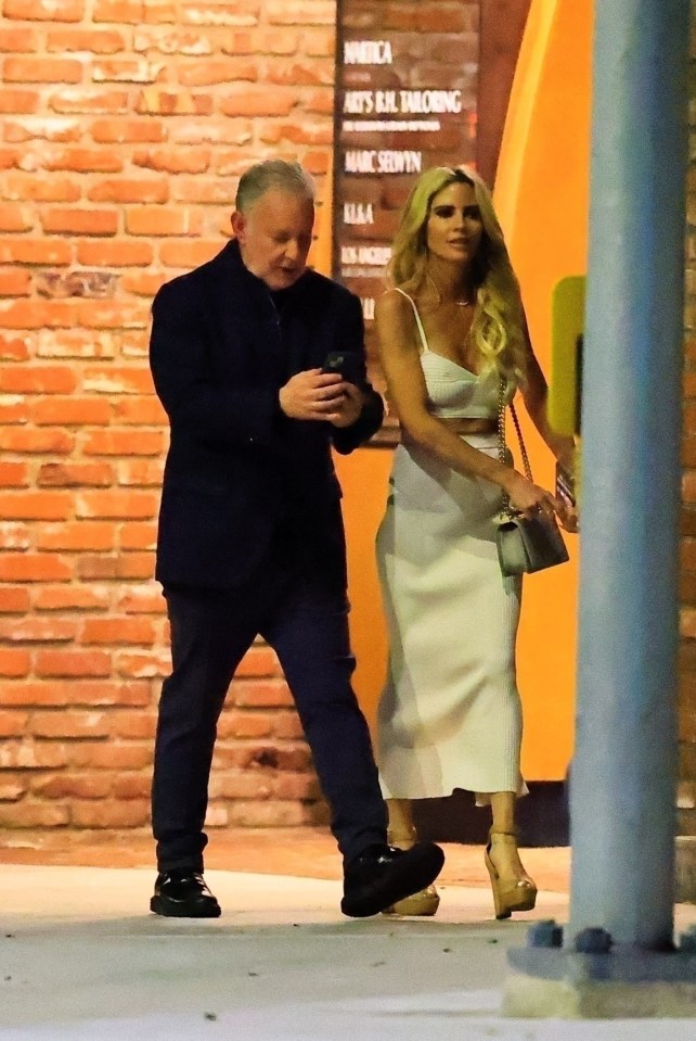 Paul Kemsley and Shana Wall walking together at night.