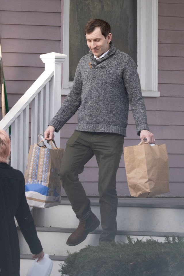 Erik Per Sullivan carrying shopping bags.