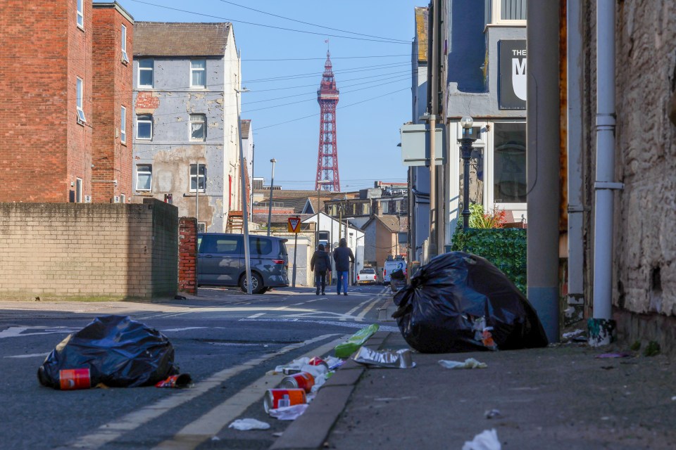 Blackpool street scene with litter and the Blackpool Tower in the distance.