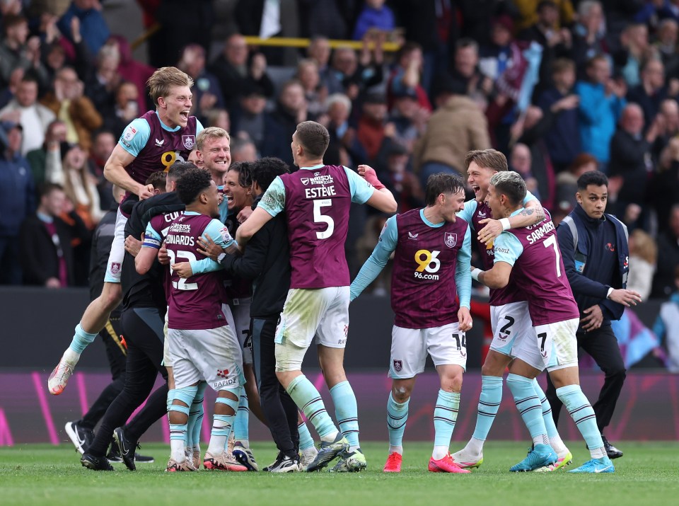 Burnley football players celebrating a victory.