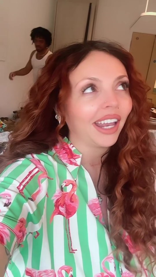 Pregnant Jesy Nelson in a flamingo shirt shares a health update.