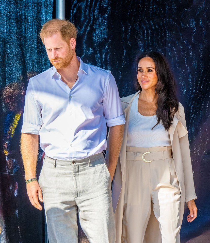 Prince Harry and Meghan Markle walking together.
