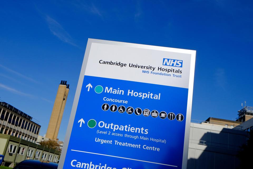 Cambridge University Hospitals NHS Foundation Trust sign: directions to Main Hospital and Outpatients.