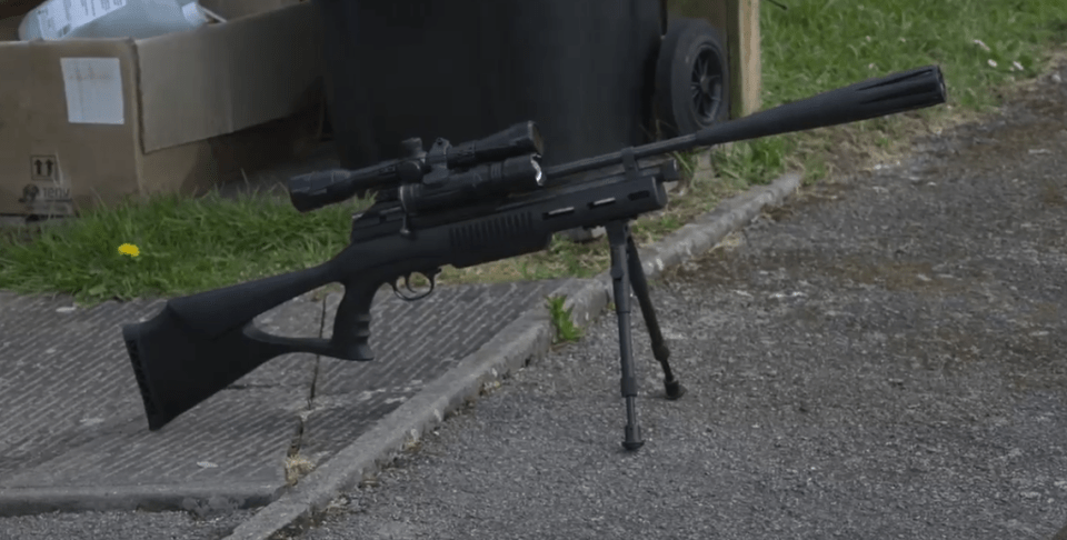 Air rifle on tripod.