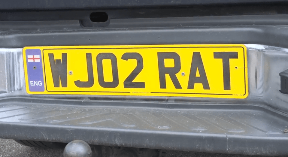 Close-up of a license plate that reads WJ02 RAT.