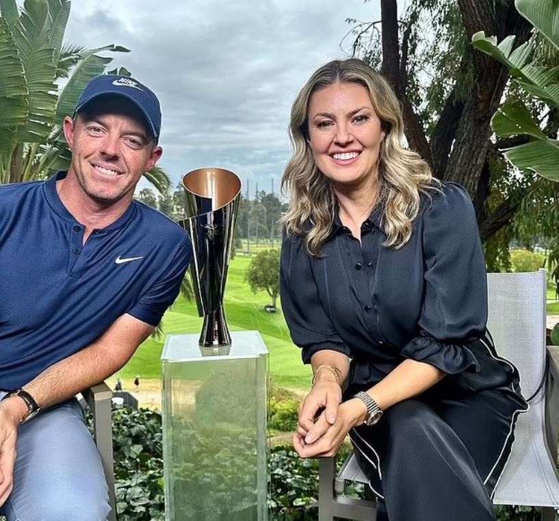 Rory McIlroy and Amanda Balionis with a trophy.