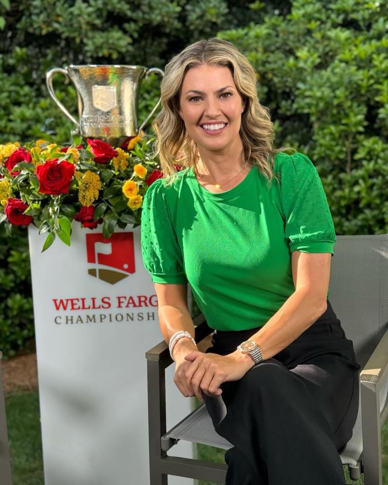 Amanda Balionis sitting near the Wells Fargo Championship trophy.